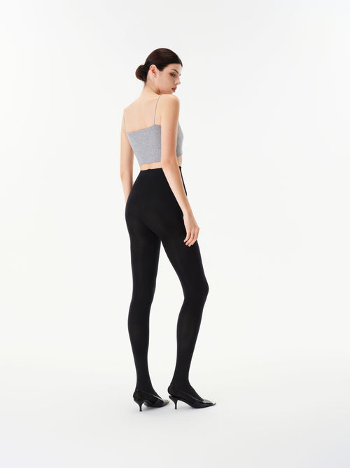 Rear three-quarter view of Yirane black opaque 80 denier tights.