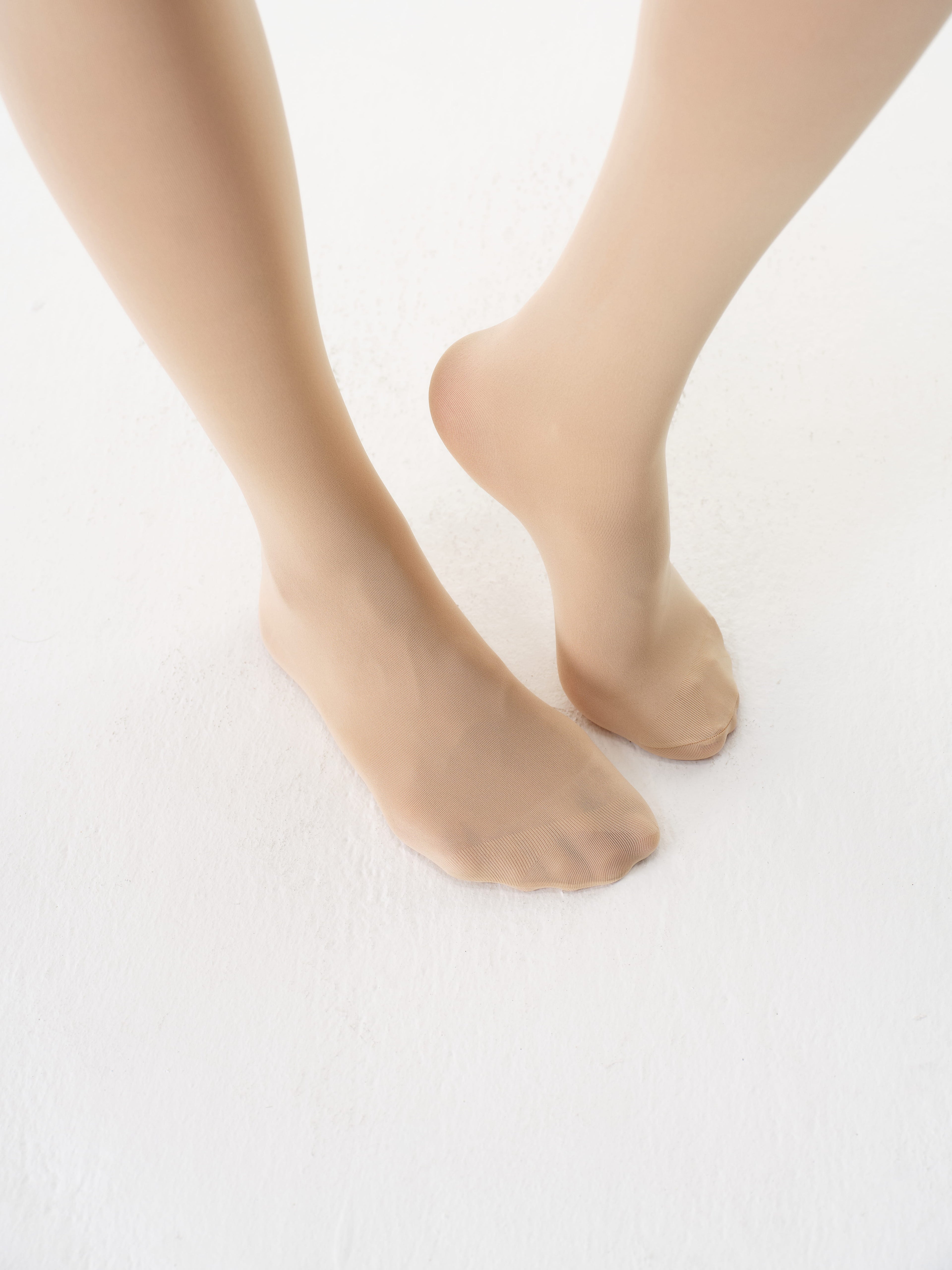 Close-up of the reinforced toe on Yirane porcelain nude 80 denier tights.