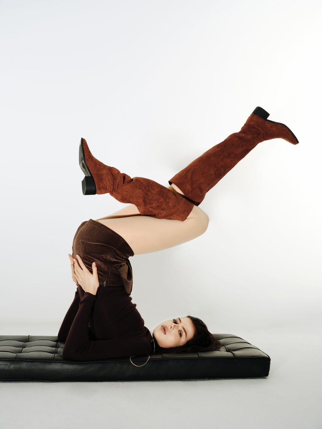 Editorial pose showcasing Yirane porcelain nude opaque 80 denier tights.